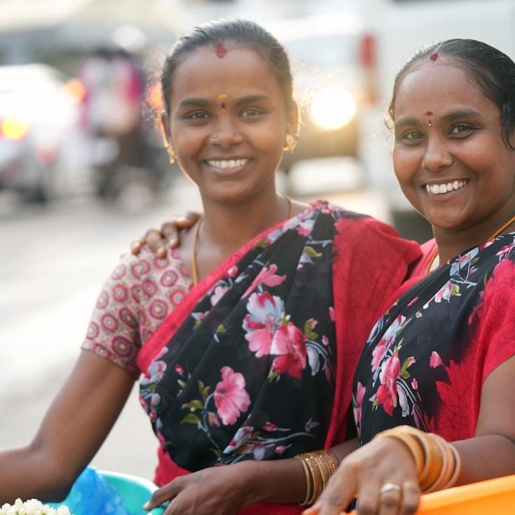 Avery Chen, Lead Design Curator at Petal Pasture Grove, reviewing corporate floral arrangements